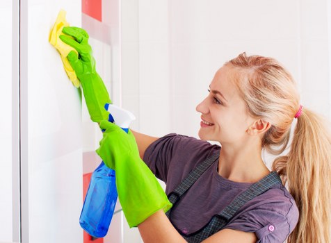 Professional carpet cleaner preparing equipment in a Covent Garden property